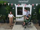 Adam Frost and Nicky Higginson cut the garland held by Molly and David Higginson